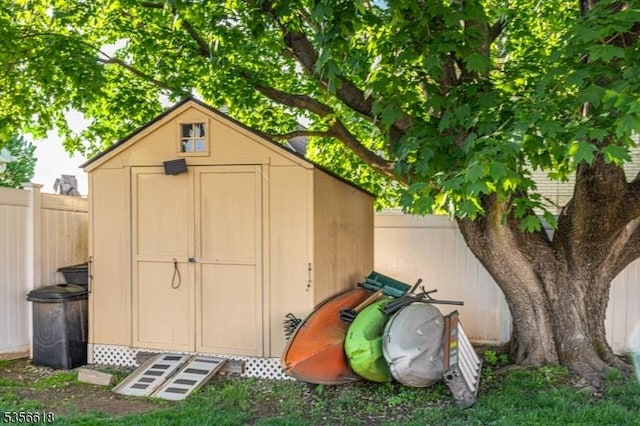 view of shed with a fenced backyard