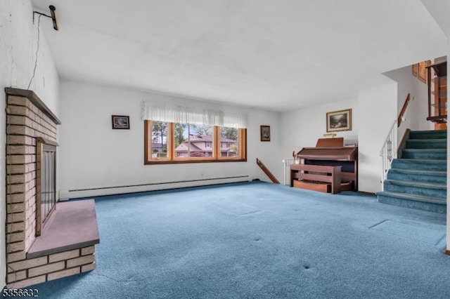 unfurnished living room with baseboard heating, carpet flooring, and stairs