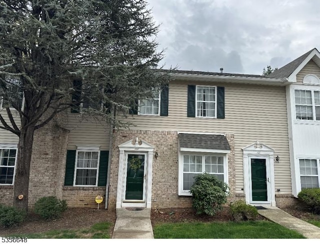 multi unit property featuring brick siding