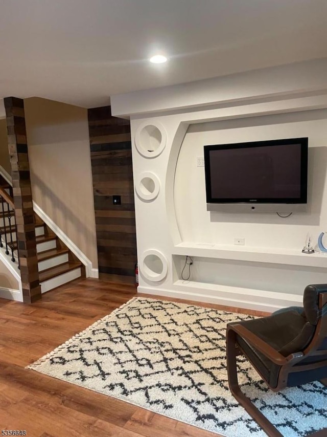 detailed view of wood finished floors, baseboards, and recessed lighting