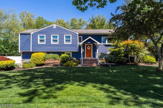 60 Wheatsheaf Rd, Clark Twp, NJ 07066 - bi-level home featuring a front yard and a chimney