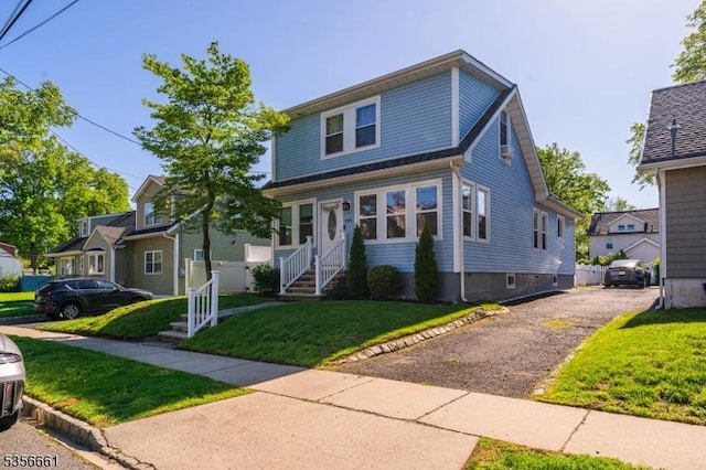 view of front of home with a front yard