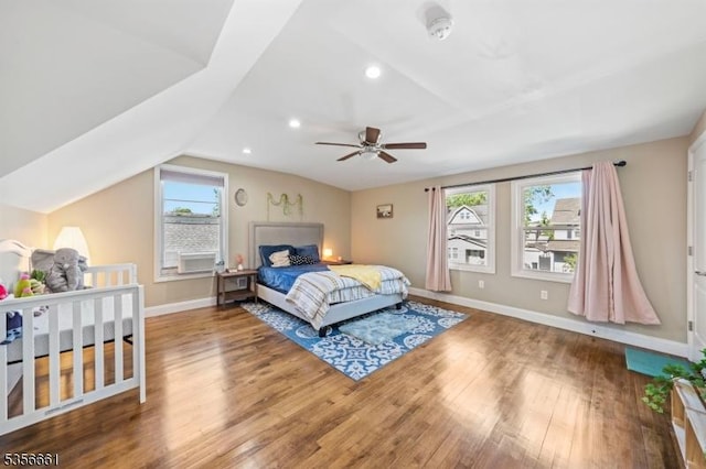 bedroom with multiple windows, baseboards, wood finished floors, lofted ceiling, and recessed lighting