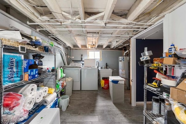 basement with washing machine and dryer and water heater