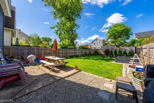 view of yard with a patio and outdoor dining area