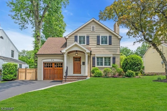 73 Lafayette Ave, Chatham Boro, NJ 07928 - view of front of home featuring driveway, a chimney, an attached garage, and brick siding