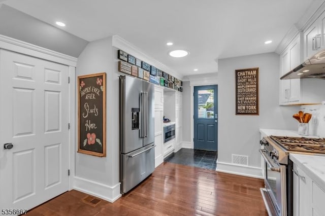73 Lafayette Ave, Chatham Boro, NJ 07928 - kitchen with high end appliances, light countertops, dark wood-type flooring, white cabinets, and recessed lighting
