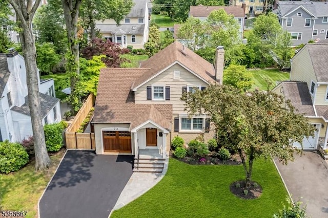 73 Lafayette Ave, Chatham Boro, NJ 07928 - view of front of home with driveway, a garage, and a chimney