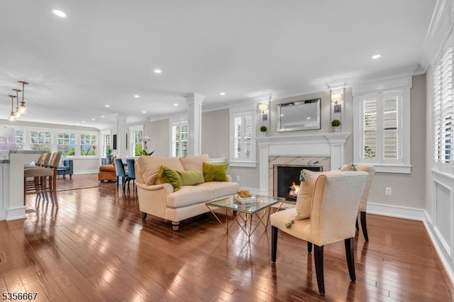 73 Lafayette Ave, Chatham Boro, NJ 07928 - living room with ornate columns, hardwood / wood-style floors, ornamental molding, a fireplace, and healthy amount of natural light