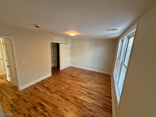 758 Somerset St Unit 2, Watchung Boro, NJ 07069 - unfurnished bedroom featuring wood finished floors, baseboards, and a closet