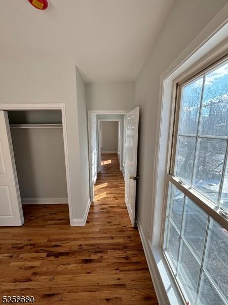 758 Somerset St Unit 2, Watchung Boro, NJ 07069 - hallway with wood finished floors and baseboards