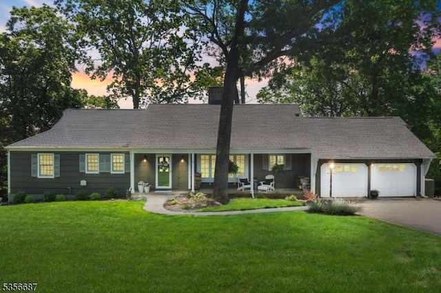 66 Skyline Dr, Morris Twp, NJ 07960 - view of front of house featuring a garage, concrete driveway, a lawn, a chimney, and roof with shingles
