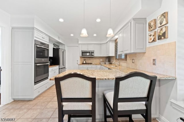 66 Skyline Dr, Morris Twp, NJ 07960 - kitchen with appliances with stainless steel finishes, a sink, a peninsula, decorative backsplash, and ornamental molding