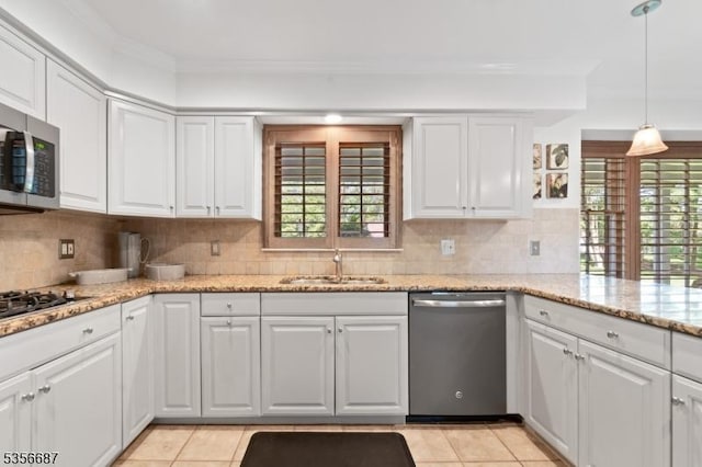 66 Skyline Dr, Morris Twp, NJ 07960 - kitchen featuring stainless steel appliances, a sink, plenty of natural light, decorative backsplash, and crown molding