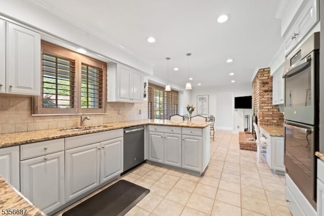 66 Skyline Dr, Morris Twp, NJ 07960 - kitchen with stainless steel appliances, a peninsula, backsplash, a sink, and recessed lighting