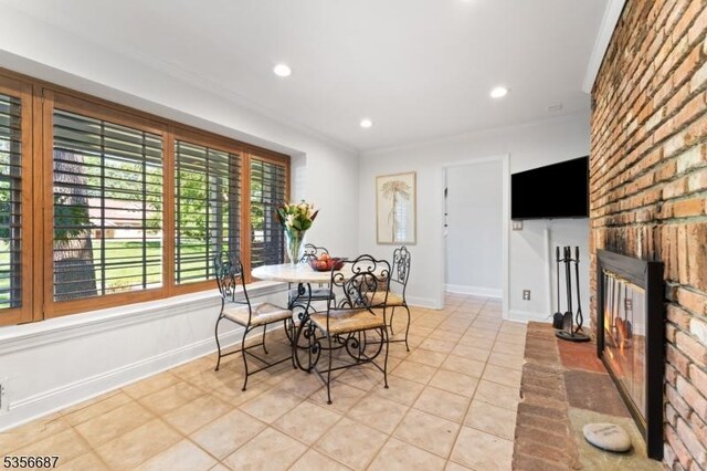 66 Skyline Dr, Morris Twp, NJ 07960 - dining area featuring a fireplace, crown molding, light tile patterned flooring, baseboards, and recessed lighting