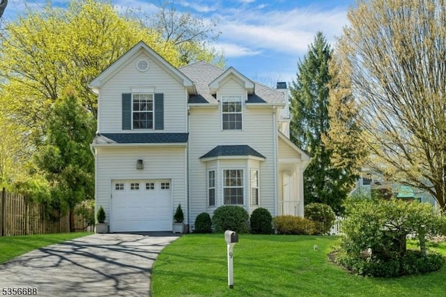 traditional home featuring a garage, driveway, a shingled roof, and a chimney