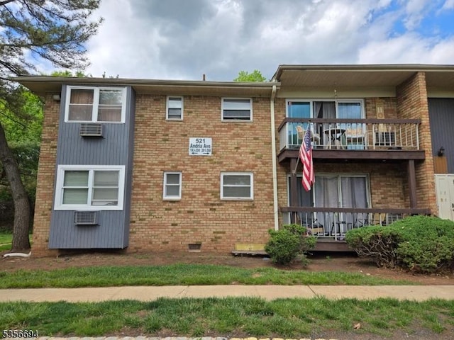 521 Andria Ave Unit 202, Hillsborough Twp, NJ 08844 - back of property featuring a balcony, brick siding, crawl space, and a wall mounted air conditioner