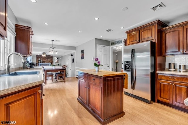 23 Andover Dr, Branchburg Twp, NJ 08853 - kitchen featuring stainless steel fridge, a sink, tasteful backsplash, light wood-style floors, and recessed lighting