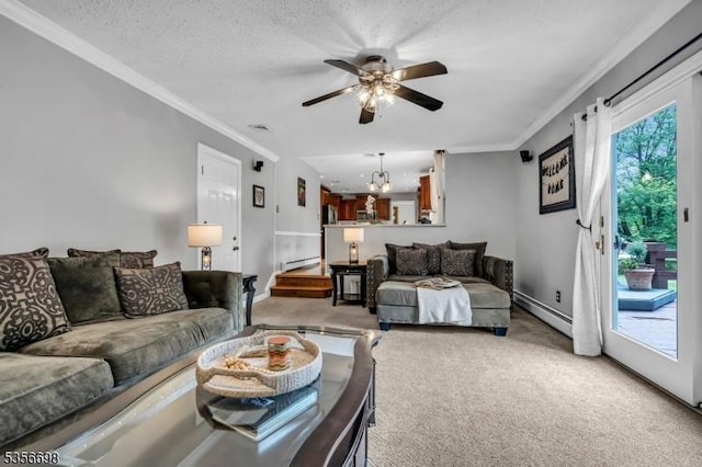 23 Andover Dr, Branchburg Twp, NJ 08853 - living room featuring a baseboard heating unit, carpet flooring, a ceiling fan, ornamental molding, and a chandelier