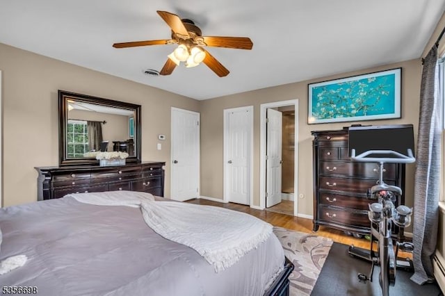 23 Andover Dr, Branchburg Twp, NJ 08853 - bedroom with wood finished floors, baseboards, and a ceiling fan