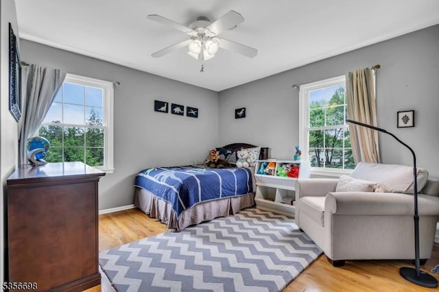 23 Andover Dr, Branchburg Twp, NJ 08853 - bedroom featuring multiple windows, wood finished floors, and a ceiling fan