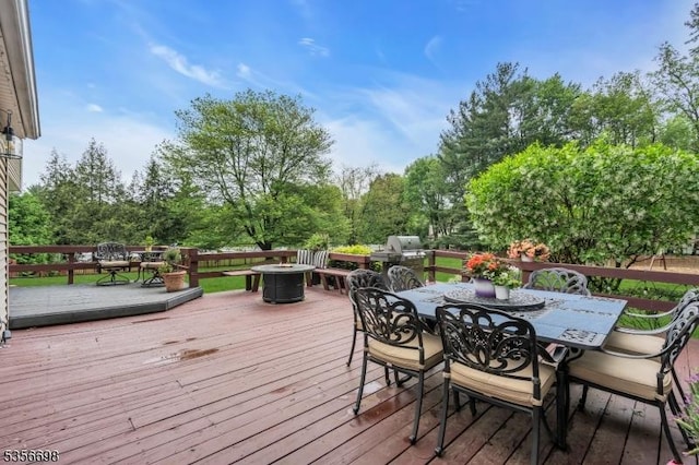 23 Andover Dr, Branchburg Twp, NJ 08853 - deck featuring outdoor dining area, an outdoor fire pit, and view of wooded area