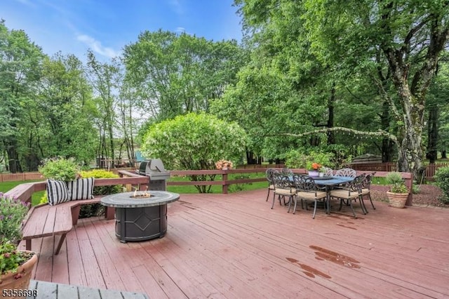23 Andover Dr, Branchburg Twp, NJ 08853 - deck featuring an outdoor fire pit, outdoor dining space, and view of wooded area
