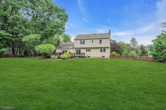 23 Andover Dr, Branchburg Twp, NJ 08853 - back of property featuring a deck and a chimney