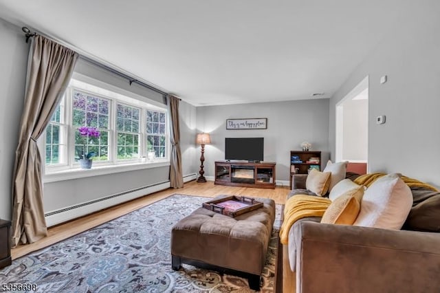 23 Andover Dr, Branchburg Twp, NJ 08853 - living room with a baseboard heating unit and wood finished floors