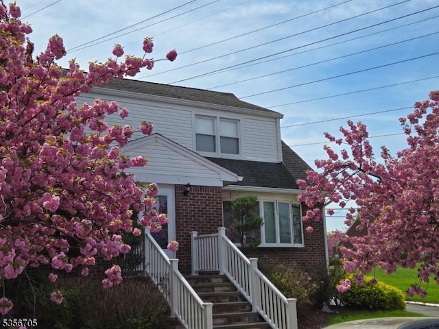 50 Newark Pl, Belleville Twp, NJ 07109 - view of front of home with brick siding and a shingled roof