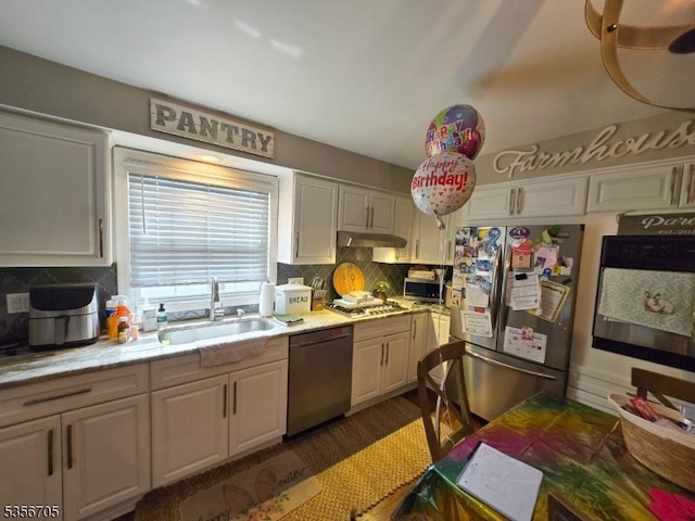 50 Newark Pl, Belleville Twp, NJ 07109 - kitchen featuring appliances with stainless steel finishes, a sink, under cabinet range hood, tasteful backsplash, and light countertops