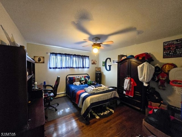 50 Newark Pl, Belleville Twp, NJ 07109 - bedroom featuring wood finished floors, a ceiling fan, and a baseboard heating unit