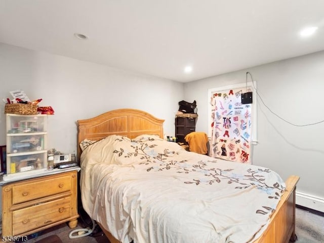 bedroom with recessed lighting and dark carpet