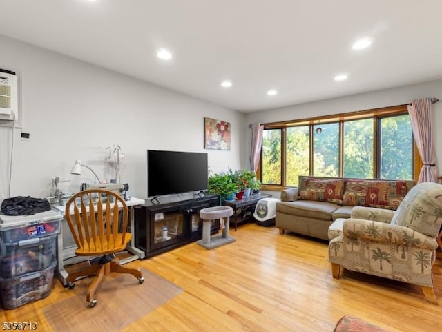 living area featuring recessed lighting and light wood finished floors