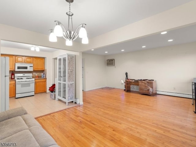 living room featuring a chandelier, baseboard heating, an AC wall unit, recessed lighting, and light wood finished floors