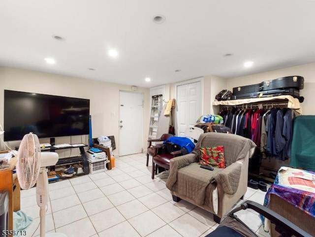 living room with light tile patterned floors and recessed lighting