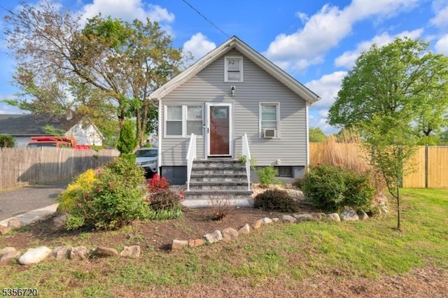 bungalow featuring entry steps and cooling unit