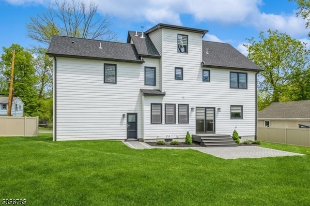back of property featuring a shingled roof