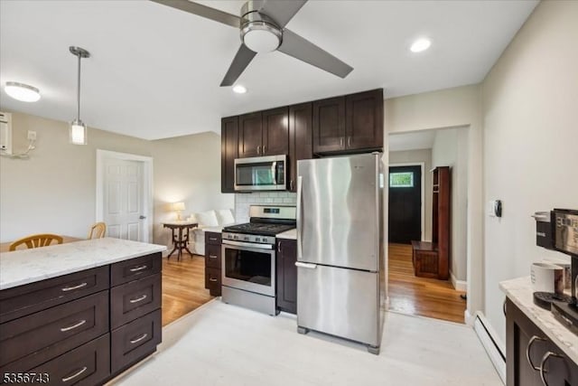 6 Cumberland Rd, Hillsborough Twp, NJ 08844 - kitchen featuring appliances with stainless steel finishes, a baseboard radiator, tasteful backsplash, ceiling fan, and dark brown cabinets