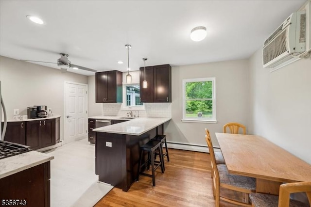 6 Cumberland Rd, Hillsborough Twp, NJ 08844 - kitchen featuring a baseboard radiator, a breakfast bar, dark brown cabinetry, light countertops, and recessed lighting