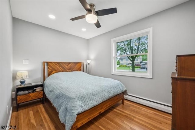 6 Cumberland Rd, Hillsborough Twp, NJ 08844 - bedroom featuring a baseboard radiator, wood finished floors, baseboards, recessed lighting, and ceiling fan