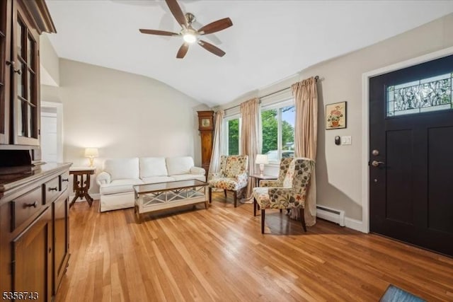6 Cumberland Rd, Hillsborough Twp, NJ 08844 - living area featuring a baseboard radiator, a ceiling fan, light wood-style flooring, vaulted ceiling, and baseboards