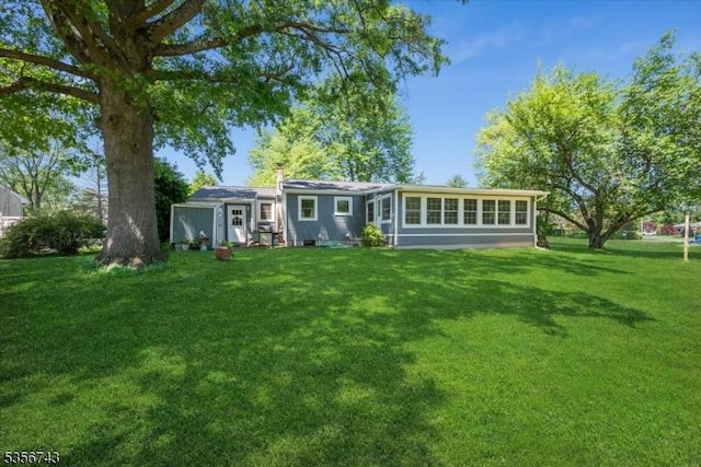 6 Cumberland Rd, Hillsborough Twp, NJ 08844 - rear view of property featuring a lawn and a chimney