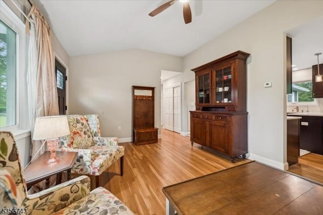 6 Cumberland Rd, Hillsborough Twp, NJ 08844 - sitting room with a ceiling fan, light wood finished floors, vaulted ceiling, and baseboards