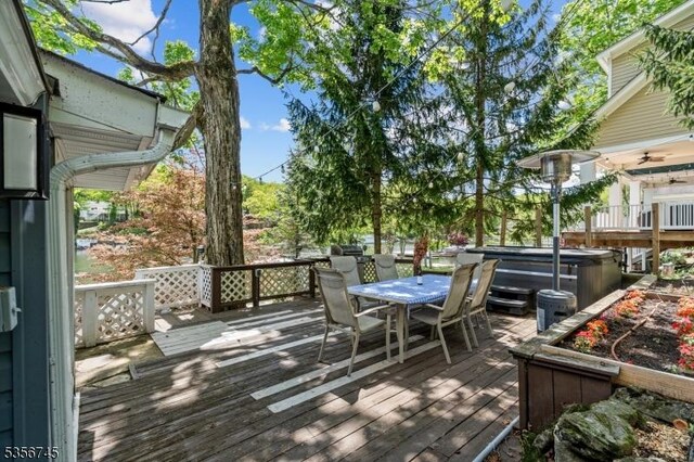 229A Squaw Trl, Hopatcong Boro, NJ 07821 - deck with a hot tub and outdoor dining space