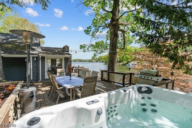229A Squaw Trl, Hopatcong Boro, NJ 07821 - wooden deck featuring a grill, a water view, a hot tub, and outdoor dining area