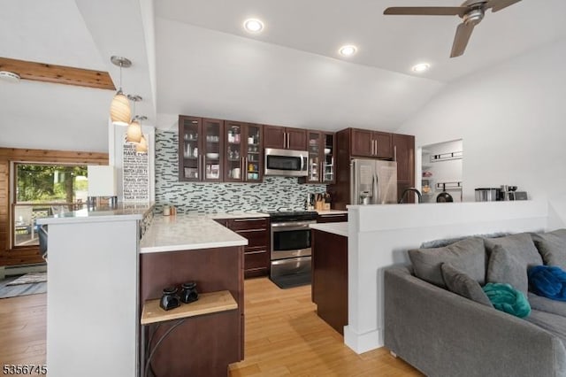 229A Squaw Trl, Hopatcong Boro, NJ 07821 - kitchen featuring appliances with stainless steel finishes, vaulted ceiling, open floor plan, light countertops, and light wood-style floors