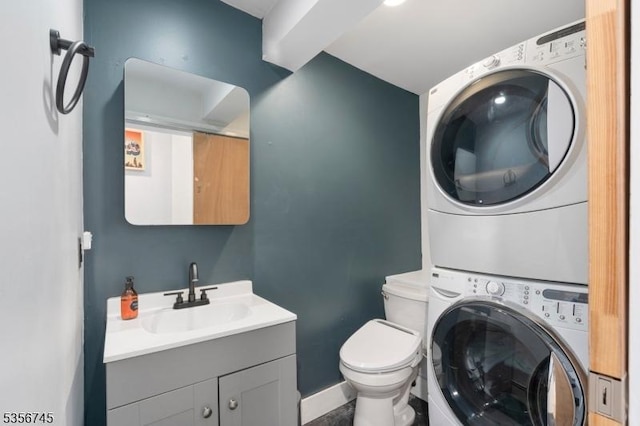 229A Squaw Trl, Hopatcong Boro, NJ 07821 - bathroom with stacked washer / drying machine, toilet, baseboards, and vanity
