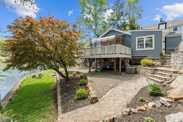 229A Squaw Trl, Hopatcong Boro, NJ 07821 - rear view of house with a sunroom, stairway, a deck, and central AC unit
